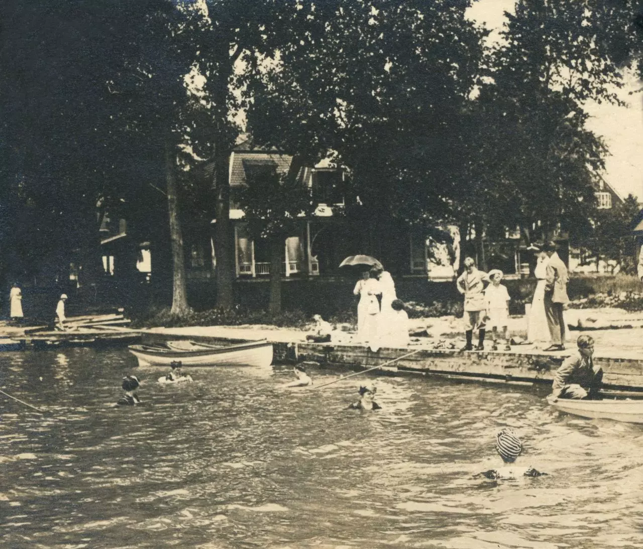 Middle Bass Club: Members on the Middle Bass Club dock, looking east down Lake Avenue.