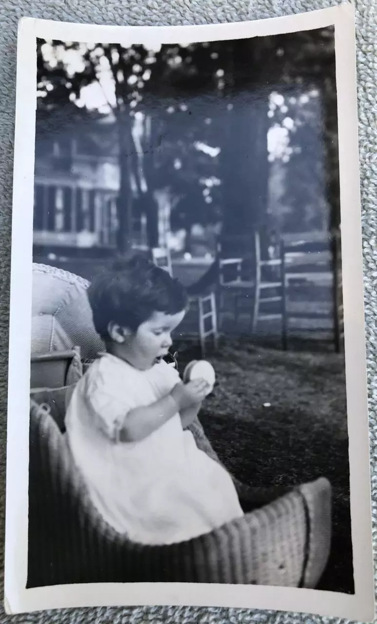 Isaac Kinsey III (Pete) in a baby carriage on the Middle Bass Club House lawn. Circa 1921. Source: Maggie Kinsey Wood