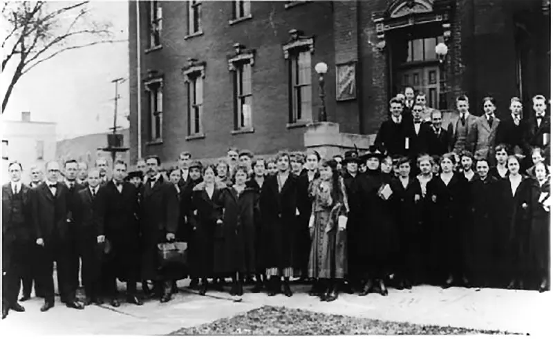 Students gathered on the steps of the building at 11th and Illinois