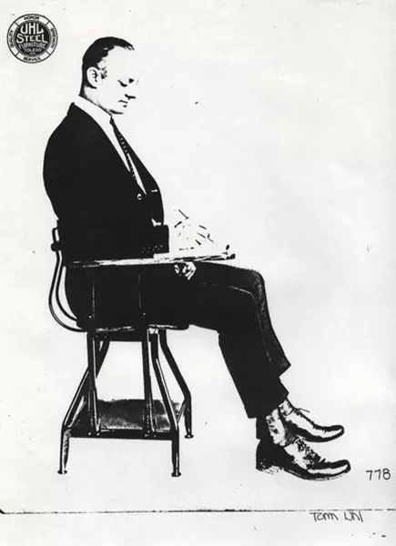 Tom Uhl seated at the desk